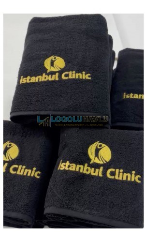 Siyah klinik havlu takımı üzerine gold özel logo nakış işlemesi