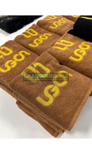 Koyu kahve havlu üzerine firma adı ve logo nakışlı berber havlusu